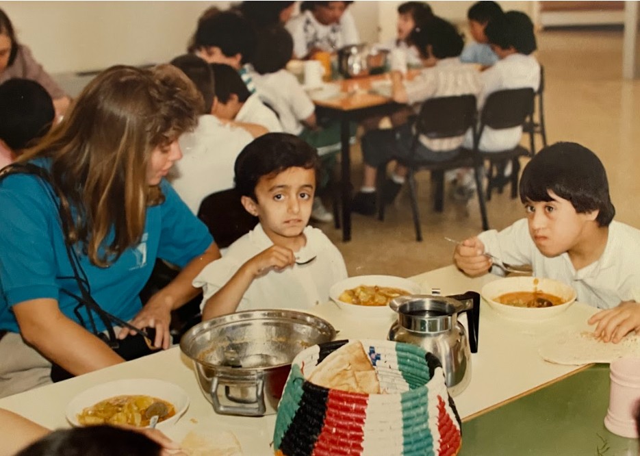 Children and a volunteer at a community centre